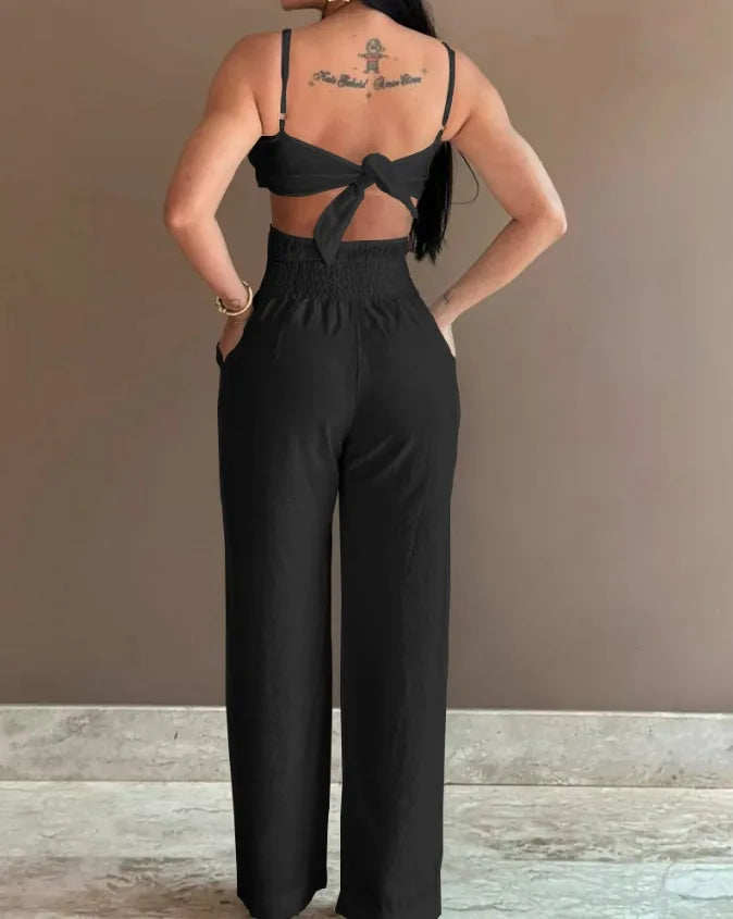 2026 Summer Spaghetti Strap Fashion Jumpsuit Women's Floral Pattern Hollow Casual Asymmetrical Collar Backless Jumpsuit Trousers